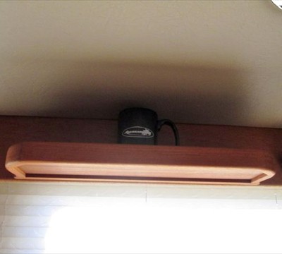 two custom-built shelves above starboard windows