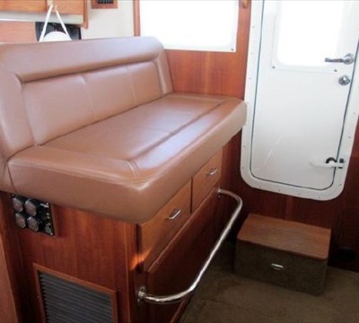 port side settee in pilothouse with storage under