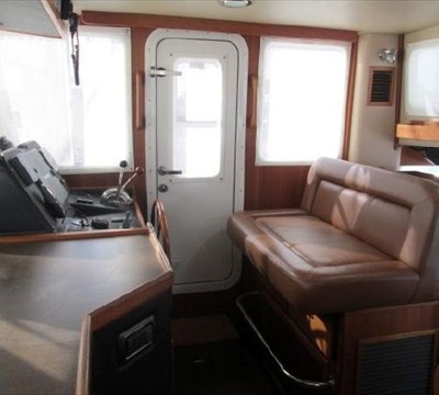 starboard settee in pilothouse, seat adjusts forward