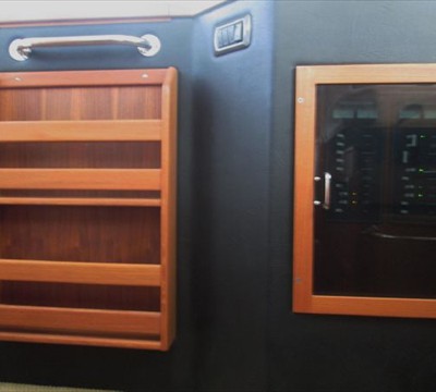 custom-built book rack and electrical panel