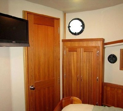 storage port side, door to pilothouse, mounted TV