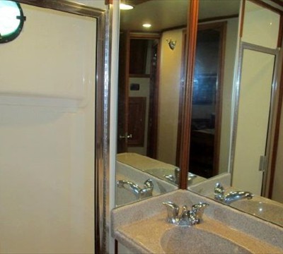 full size shower with glass door and port light