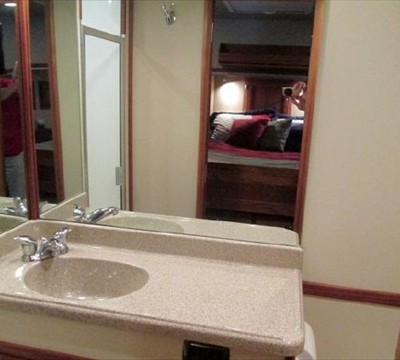 molded vanity and sink and lots of mirrors