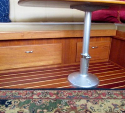 storage under settee, table lowers to allow berth to come out