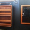 custom-built book rack and electrical panel