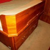 four drawers under berth, custom wood bolster at foot of bed