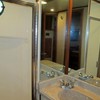 full size shower with glass door and port light