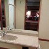 molded vanity and sink and lots of mirrors