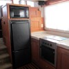 galley looking forward, fridge/freezer, microwave & electric stove with oven