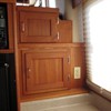 extra custom-built cabinet next to microwave