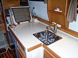Galley looking forward, folded helm seat