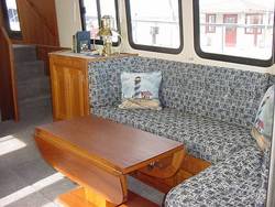 Salon settee w/ teak hi-lo table