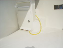 Built-in storage for shore power cord